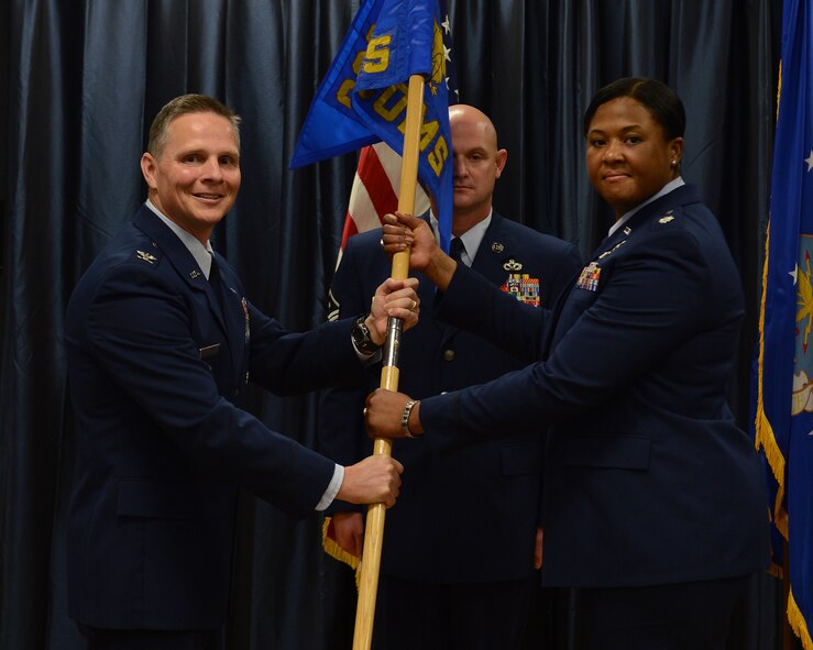 Lt. Col. Patrice Holmes assumes command of the 608th Air Communications Squadron from Col. Thomas Hesterman, 8th Air Force vice commander, during a change of command ceremony at Barksdale Air Force Base, La., July 17, 2014. Holmes previously served as Country Program Director for 28 countries at the Defense Security Cooperation Agency, Office of the Secretary of Defense-Policy, Pentagon, Va. (U.S. Air Force photo/Senior Airman Benjamin Gonsier)