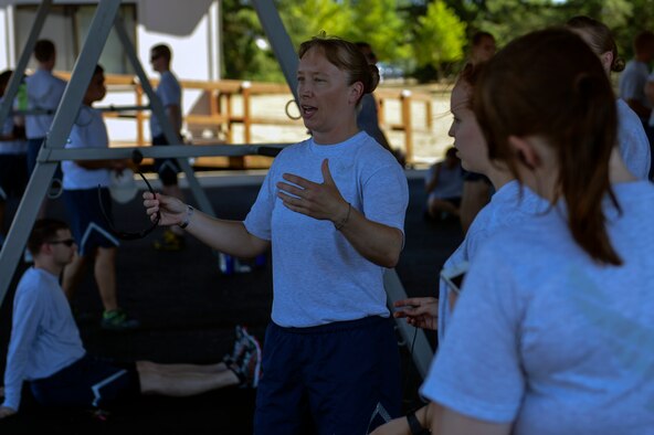 Capt. Amanda Turcotte, 627th Force Support Squadron sustainment flight commander, briefs her Airmen about their running route July 16, 2014 at Joint Base Lewis-McChord, Wash. Turcotte had her resiliency put to the test twice in her Air Force career as she fought, and won, against two medical evaluation boards trying to separate her. (U.S. Air Force photo/Staff Sgt. Russ Jackson)