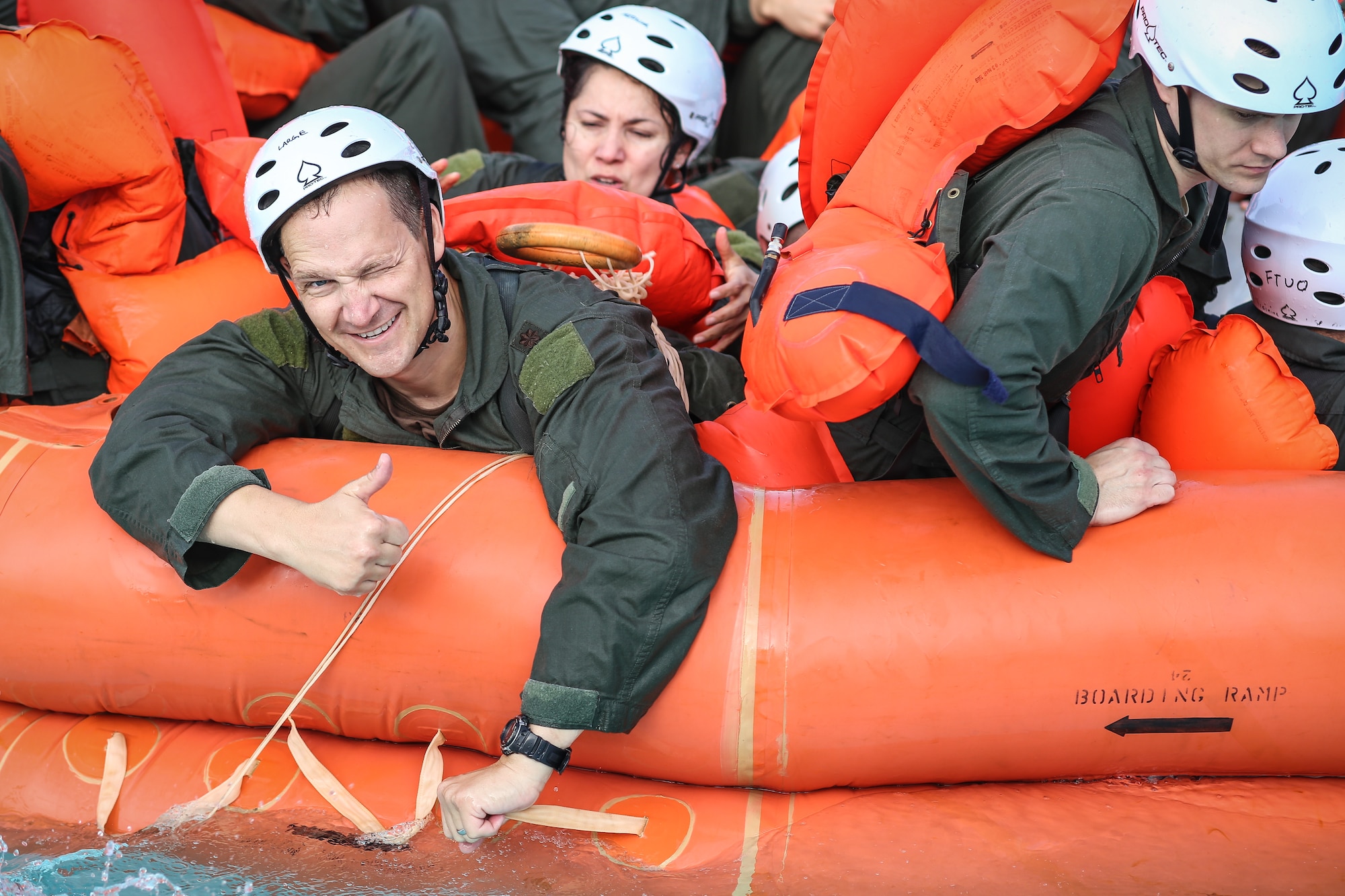 Maj. Robert Zeese, assigned to the 970th Airborne Air Control Squadron, gives a thumbs up July 13 after completing the in-water portion of water survival training at White Water Bay in Oklahoma City. Zeese is an navigator assigned to the Air Force Reserve’s only Airborne Warning and Control System flying squadron. (U.S. Air Force photo/Staff Sgt. Caleb Wanzer)