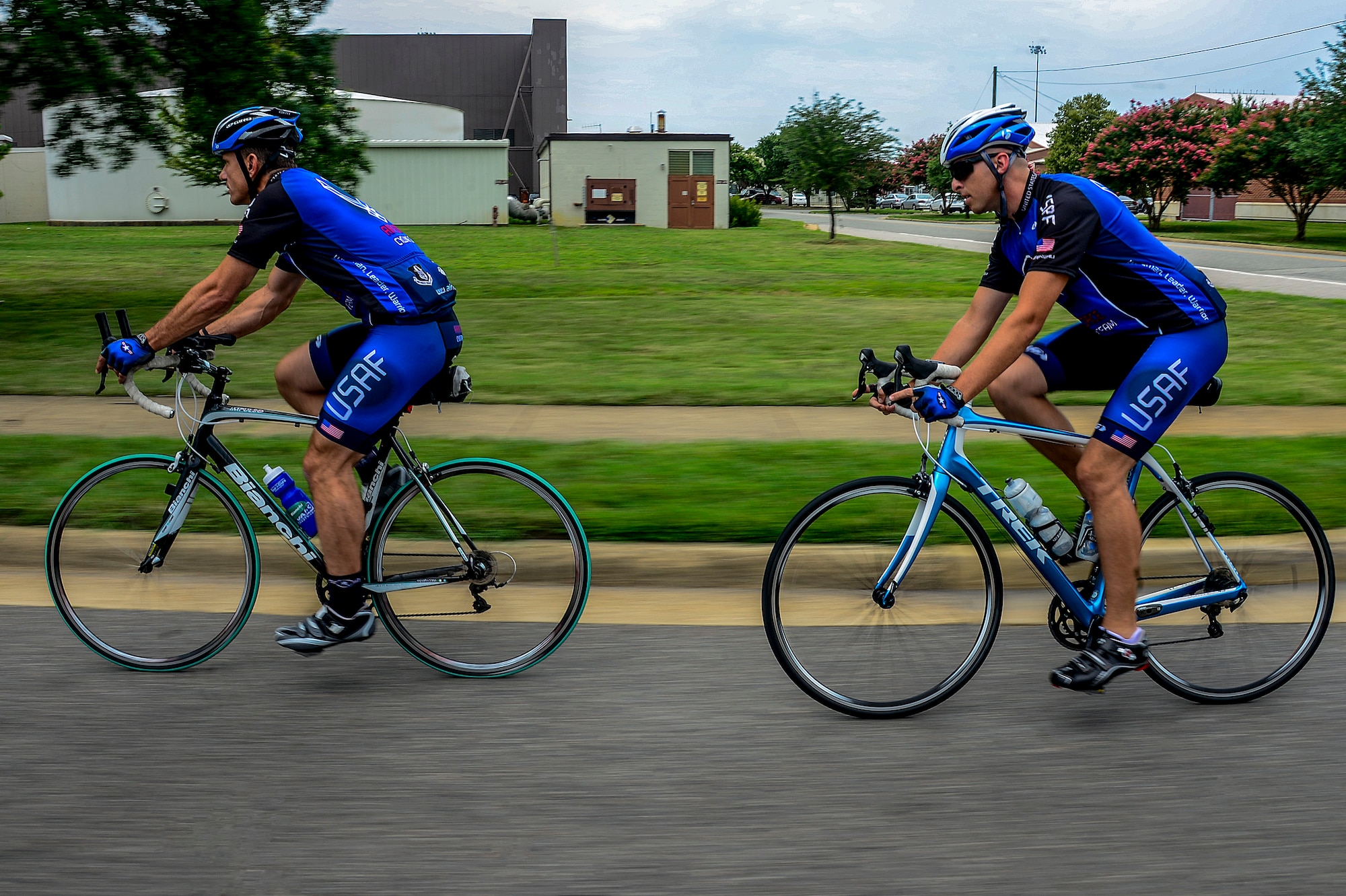 U.S. Air Force Col. Thaddeus Chamberlain, right, and Staff Sgt. Aaron Kirby, left, members of the Air Force Cycling Team, train for an upcoming event at Langley Air Force Base, Va., July 16, 2014. Chamberlain and Kirby are part of the nine AFCT members from Langley who will join the rest of the 130- member-team in Iowa for The Register’s Annual Great Bicycle Ride Across Iowa July 20 - 26. (U.S. Air Force photo by Senior Airman Kayla Newman/Released) 
