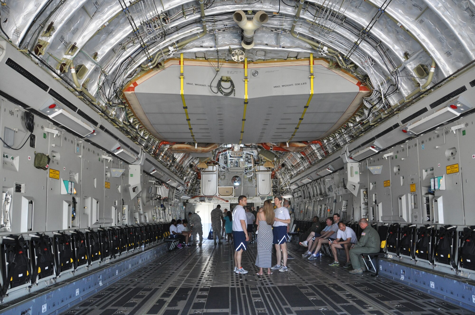 Airmen and their families tour a C-17 Globemaster III aircraft during the 512th Airlift Wing's Wingman Day Picnic July 12, 2014, at Dover Air Force Base, Del. The Reserve wing and its guests could also tour a C-5 Super Galaxy aircraft during the event. (U.S. Air Force photo/Staff Sgt. Mercedes Crossland)