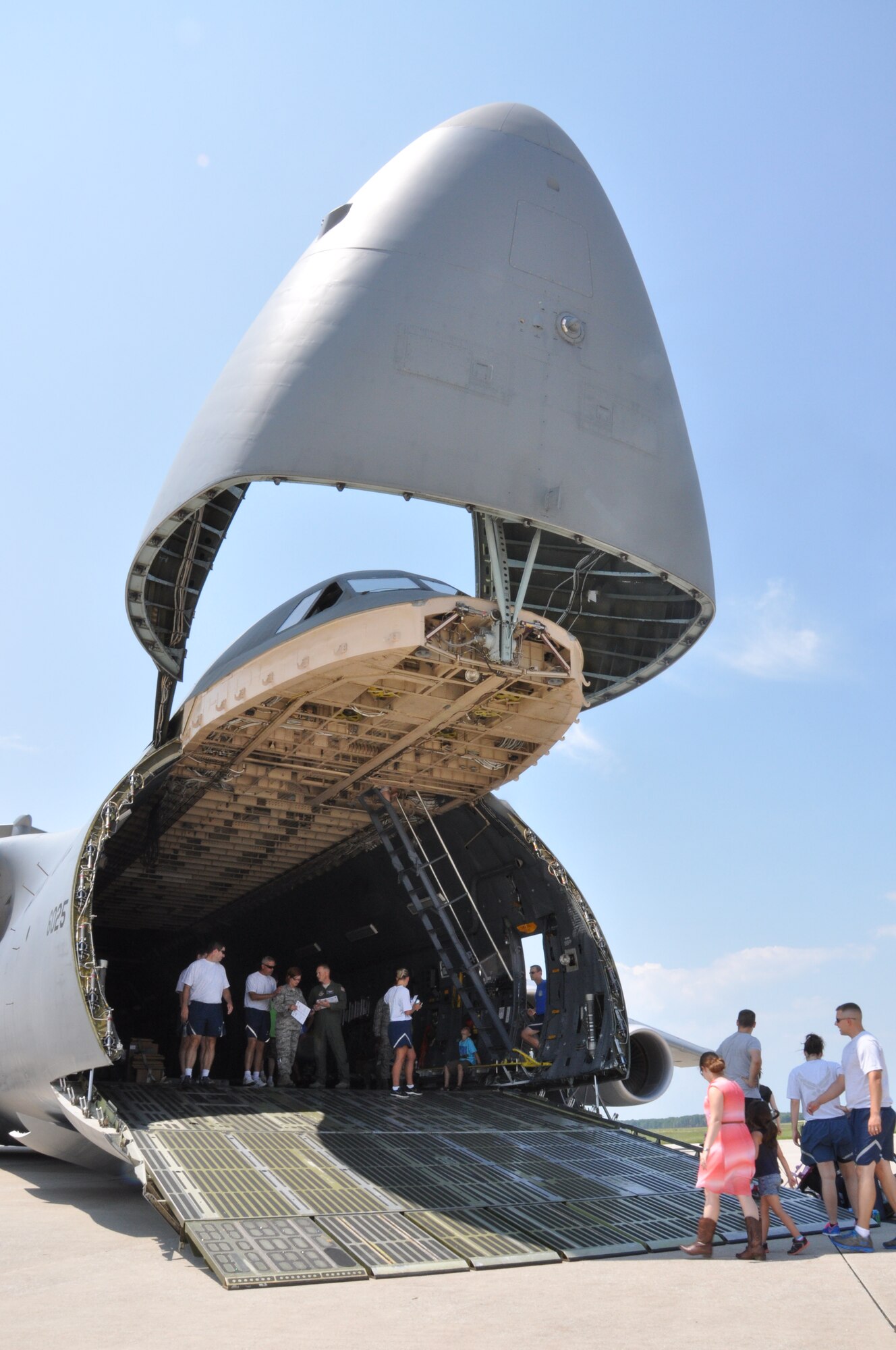 Airmen and their families tour a C-5 Super Galaxy aircraft during the 512th Airlift Wing's Wingman Day Picnic July 12, 2014, at Dover Air Force Base, Del. The Reserve wing and its guests could also tour a C-17 Globemaster III during the event. (U.S. Air Force photo/Staff Sgt. Mercedes Crossland) 