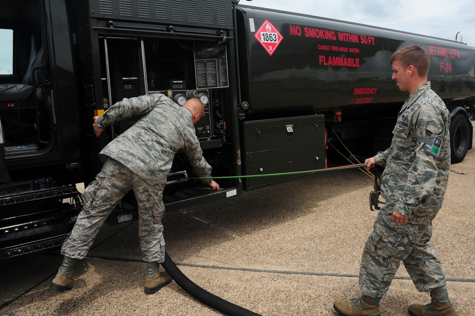 Airmen from the 19th Logistic Readiness Squadron fuels management flight prepare to refuel a C-130J July 10, 2014, at Little Rock Air Force Base, Ark. The flight performs nearly 30 refuels within 24 hours, which enables seven flying squadrons to effectively achieve their mission objectives. (U.S. Air Force photo by Senior Airman Kaylee Clark)
