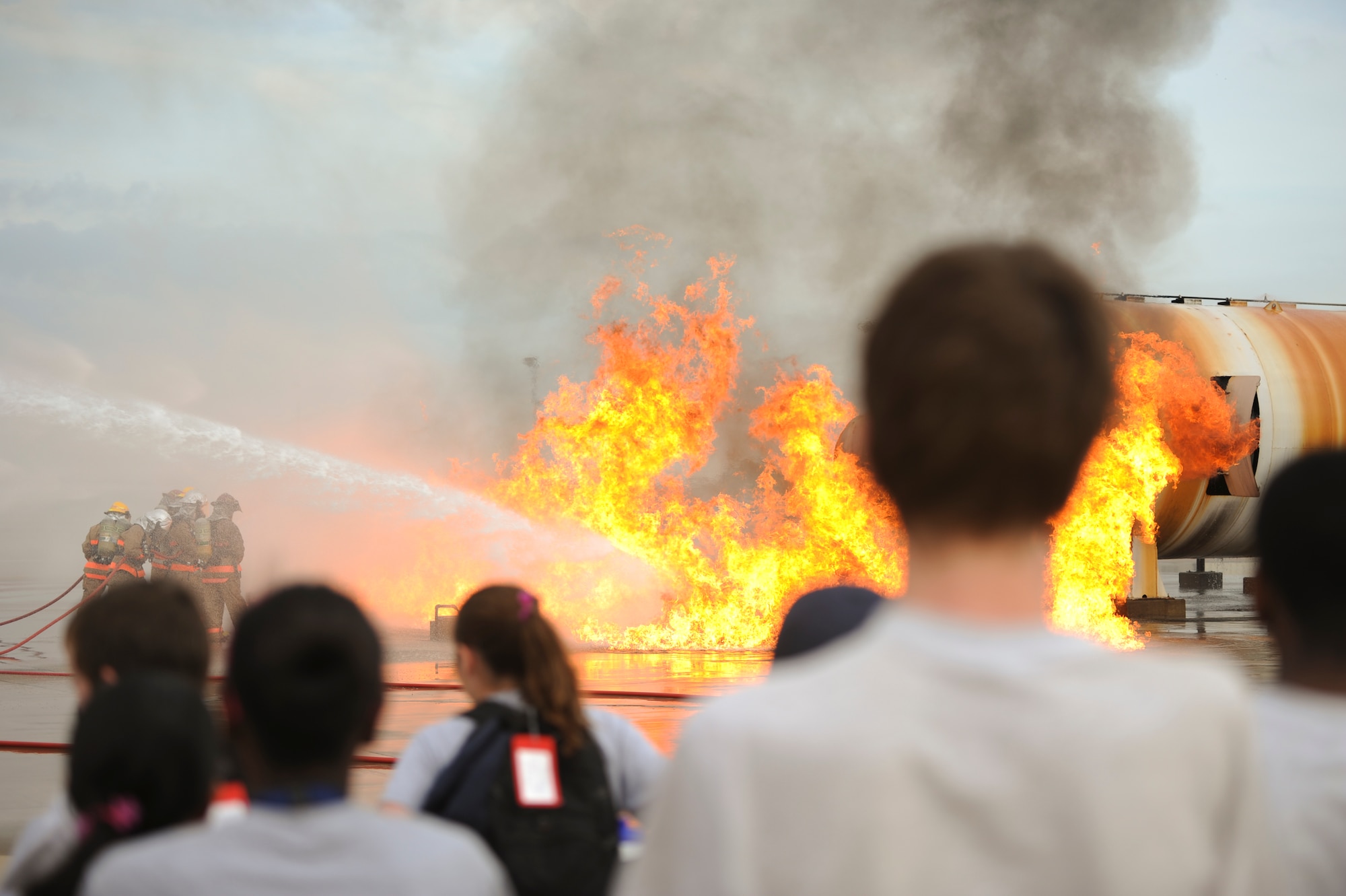 GOODFELLOW AIR FORCE BASE, Texas – Drug Education for Youth members watch a firefighter training simulation at the Department of Defense Louis F. Garland
 Fire Academy here July 16. After the training simulation, the DEFY members toured the rest of the training pad. (U.S. Air Force photo/ Airman 1st Class Devin Boyer)