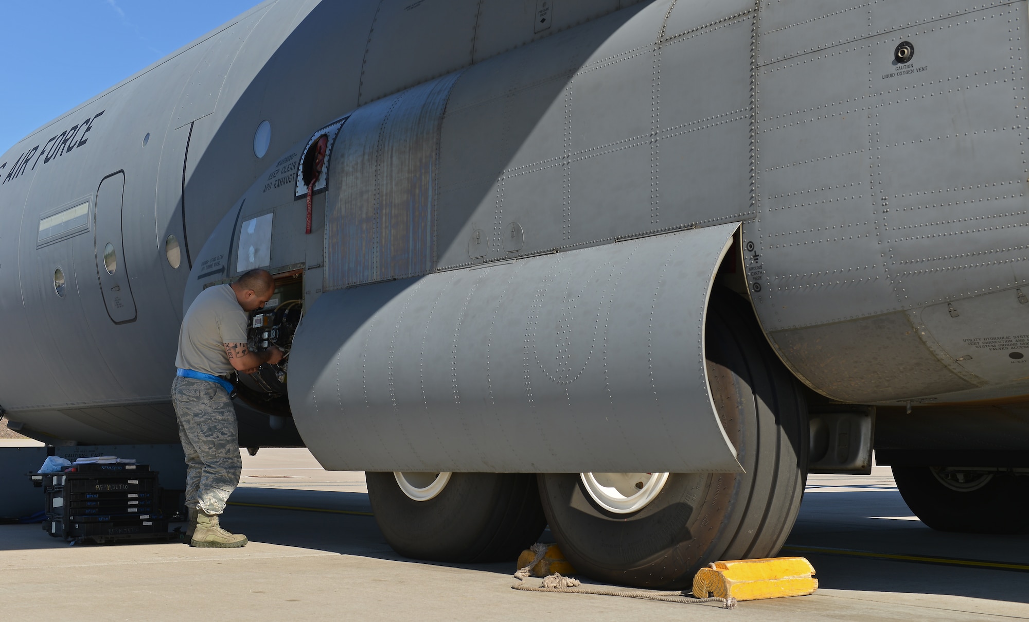 Tech. Sgt. Edwin Huertas, 86th Aircraft Maintenance Squadron propulsion engineer NCOIC, fixes a part on a C-130J Super Hercules, June 7, 2014, on Ramstein Air Base, Germany. Members of the 86th AMXS work round the clock to ensure aircraft are mission ready at all times.(U.S. Air Force photo by/Senior Airman Holly Mansfield)