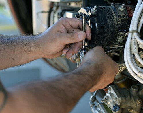 Tech. Sgt. Edwin Huertas, 86th Aircraft Maintenance Squadron propulsion engineer NCOIC, fixes a part on a C-130J Super Hercules, June 7, 2014, on Ramstein Air Base, Germany. Members of the 86th AMXS work round the clock to ensure aircraft are mission ready at all times. (U.S. Air Force photo by/Senior Airman Holly Mansfield)