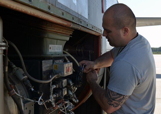 Tech. Sgt. Edwin Huertas, 86th Aircraft Maintenance Squadron propulsion engineer NCOIC, fixes a part on a C-130J Super Hercules, June 7, 2014, on Ramstein Air Base, Germany. Members of the 86th AMXS work round the clock to ensure aircraft are mission ready at all times.(U.S. Air Force photo by/Senior Airman Holly Mansfield)