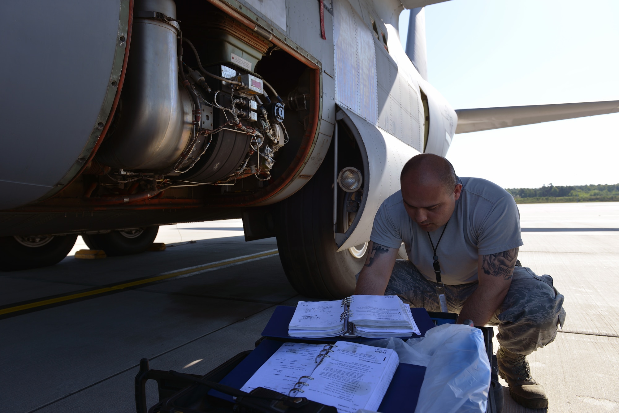 Tech. Sgt. Edwin Huertas, 86th Aircraft Maintenance Squadron propulsion engineer NCOIC, checks his tools before fixing a part on a C-130J Super Hercules, June 7, 2014, on Ramstein Air Base, Germany. Members of the 86th AMXS work round the clock to ensure aircraft are mission ready at all times.(U.S. Air Force photo by/Senior Airman Holly Mansfield)