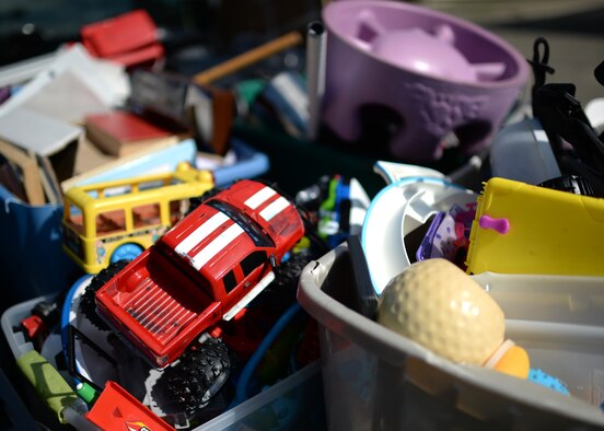 Plastic bins of toys, books and electronics rest in a pickup truck bed destined for the base recycle center July 15, 2014, at Spangdahlem Air Base, Germany. These items are from the Airman's Attic, a collection and distribution point that allows service members to shop for donated items at no cost. The summer months can increase the numbers of military members moving to a new base, so the amount of donations typically triples in this timeframe. Donations are evaluated for wear and tear, and the older items are recycled. (U.S. Air Force photo by Staff Sgt. Daryl Knee/Released)