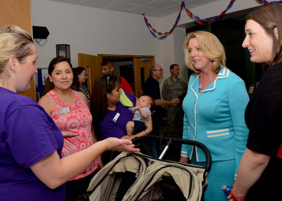 Secretary of the Air Force Deborah Lee James talks with Mildenhall members during a Hearts Apart event July 16, 2014, at RAF Mildenhall, England. James visited the Hearts Apart event to meet with spouses and family members of deployed Airmen. (U.S. Air Force photo/Airman 1st Class Victoria Taylor)