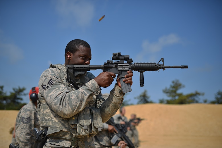 Members of the 106th Rescue Wing's Security Forces Squadron train on the M4 carbine and M9 pistol July 13, 2014, at the firing range on Francis S. Gabreski Air National Guard Base, N.Y. (New York Air National Guard photo/Senior Airman Christopher S. Muncy)