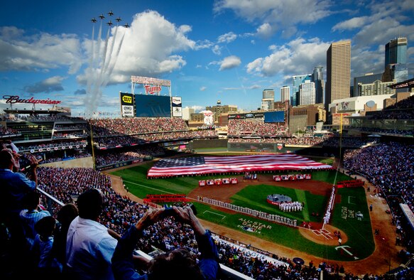 The Thunderbirds perform a flyover during the national anthem at the Major League Baseball’s All-Star Game July 15, 2014, in Minneapolis, Minn. The Thunderbirds are the Air Force’s precision flying demonstration team that flies red, white and blue F-16 Fighting Falcons (U.S. Air Force photo/Master Sgt. Stan Parker)