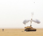 Minnesota Army National Guard members fire an M109A6 Paladin during the 34th Infantry Division's 1-125 Field Artillery B Battery's live fire exercise in northern Kuwait, Feb. 16, 2012.