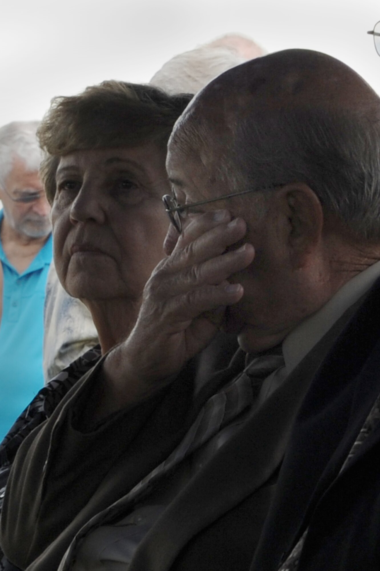 Paul Martin, the oldest brother of Airman 3rd Class Howard Martin, wipes a tear from his eye during his brother's funeral July 12, 2014, in Elwood, Ind. Howard Martin died November 22, 1952, during a C-124 crash in Alaska. His remains were not recovered or identified until earlier in 2014 and were returned home July 10. (U.S. Air Force photo/Senior Airman Sarah Hall-Kirchner)