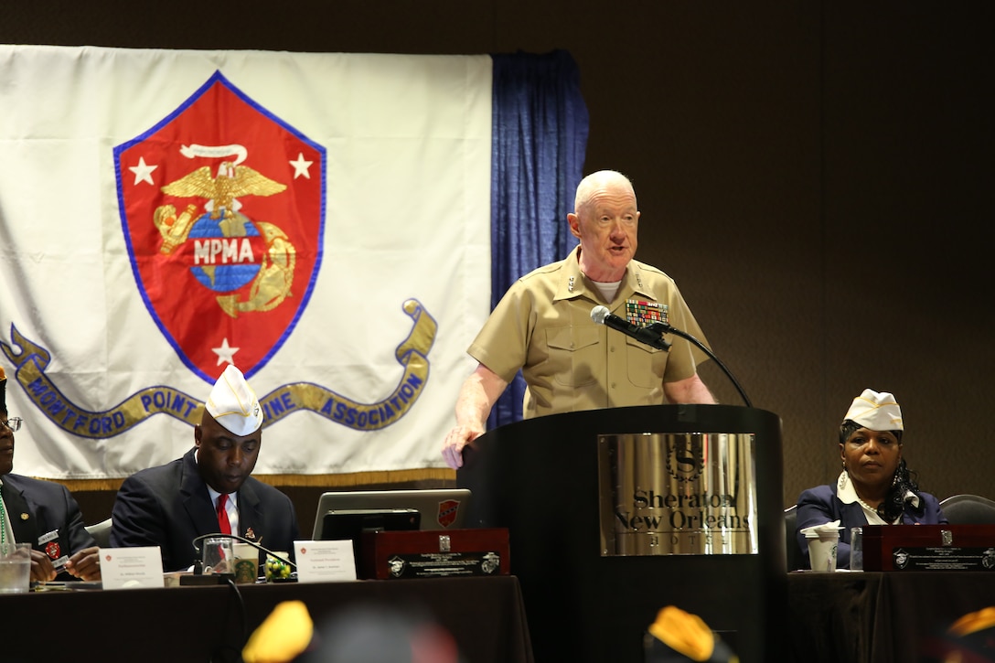 Lt. Gen. Richard P. Mills, commander of Marine Forces Reserve, greets the audience during the 49th Annual Montford Point Marine Association Conference, July 17, 2014. Mills spoke to chapter leaders, members and original Montford Point Marines in attendance during the opening day of the conference. 