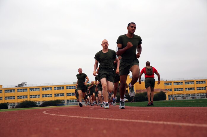 Recruits of Charlie Company, 1st Recruit Training Battalion, race each other during interval sprints at Marine Corps Recruit Depot San Diego, July 14. Recruits will be tested physically throughout recruit training.