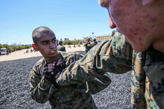 Recruit Angle M. Shott, Platoon 3226, Kilo Company, 3rd Recruit Training Battalion, practices the reverse wrist lock during Marine Corps Martial Arts Program training at Marine Corps Recruit Depot San Diego, Calif., July 11. Shott is a Lompoc, Calif., native and was recruited out of Recruiting Substation Santa Barbara, Calif.