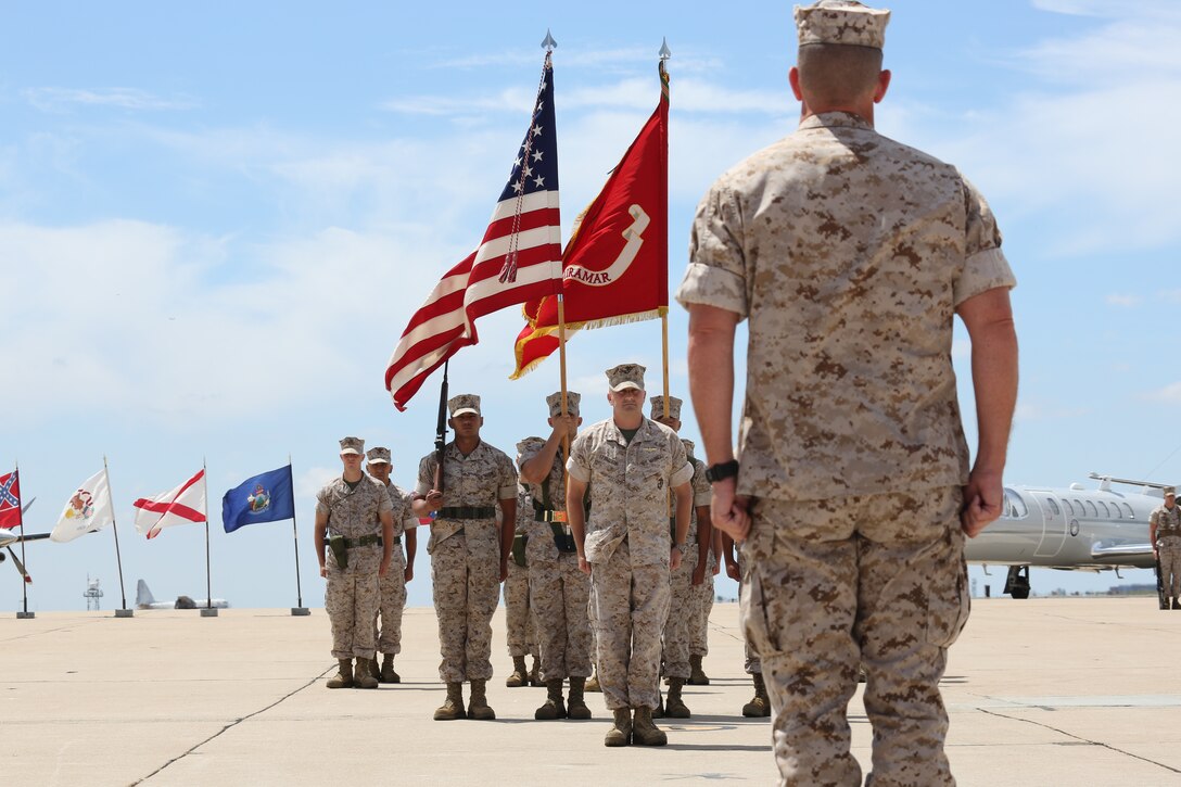 Lt. Col. Daniel J. Levasseur (center), outgoing Headquarters and Headquarters Squadron commanding officer, prepares to salute Col. John Farnam, Marine Corps Air Station Miramar commanding officer during, a Headquarters and Headquarters Squadron change of command ceremony aboard MCAS Miramar, Calif., July 18. Levasseur relinquished command of H&HS to Lt. Col. Mitchell A. Criger.