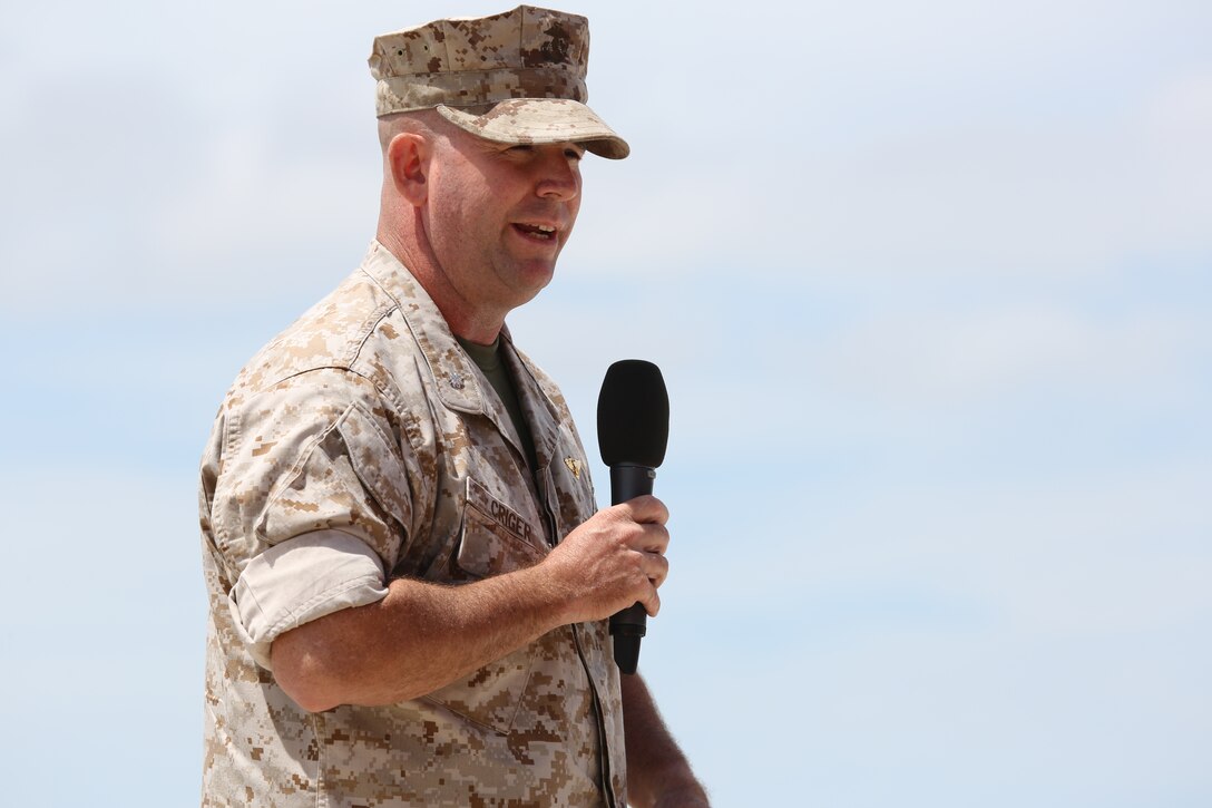Lt. Col. Mitchell A. Criger, Headquarters and Headquarters Squadron commanding officer, addresses Marines, Sailors, family and friends during his change of command ceremony aboard MCAS Miramar, Calif., July 18. Criger will follow Lt. Col. Daniel J. Levasseur as the new commanding officer for the squadron.