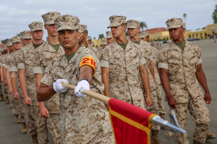 Lance Cpl. Calvin J. Gutierrez, Platoon 2101, Echo Company, 2nd Recruit Training Battalion, presents the guidon during graduation practice at Marine Corps Recruit Depot San Diego, Calif., July 15. Gutierrez is a El Monte, Calif., native and was recruited out of Recruiting Substation Montebello, Calif.	