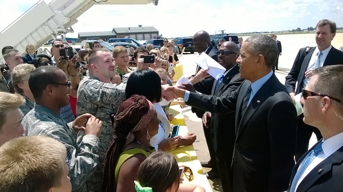 Technical Sgt. Joel Miller, 166th Maintenance Squadron, Delaware Air National Guard, shakes hands with President Barack Obama on July 17, 2014 at the New Castle Air National Guard Base, Del. Air Force One brought the president to the air base en route to the Port of Wilmington, Delaware to announce a new initiative to increase private sector investment in our nation’s infrastructure. Miller said, “It was definitely a big experience that you only see on T.V. He’s the commander in chief, and it was definitely a monumental experience.” Miller said the president told him, “Thank you for your service,” and that Miller replied, “Thank you, Mr. President.” (U.S. Air National Guard photo by Staff Sgt. Bryan Ross)