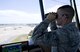 Airman 1st Class Justin Barbash, 1st Special Operations Support Squadron air traffic control apprentice, observes aircraft approaching the flightline from the base tower on Hurlburt Field, Fla., July 17, 2014. Binoculars are key tools in aiding air traffic controllers in spotting, identifying and directing aircraft within view of the flightline. (U.S. Air Force photo/Senior Airman Kentavist P. Brackin)
