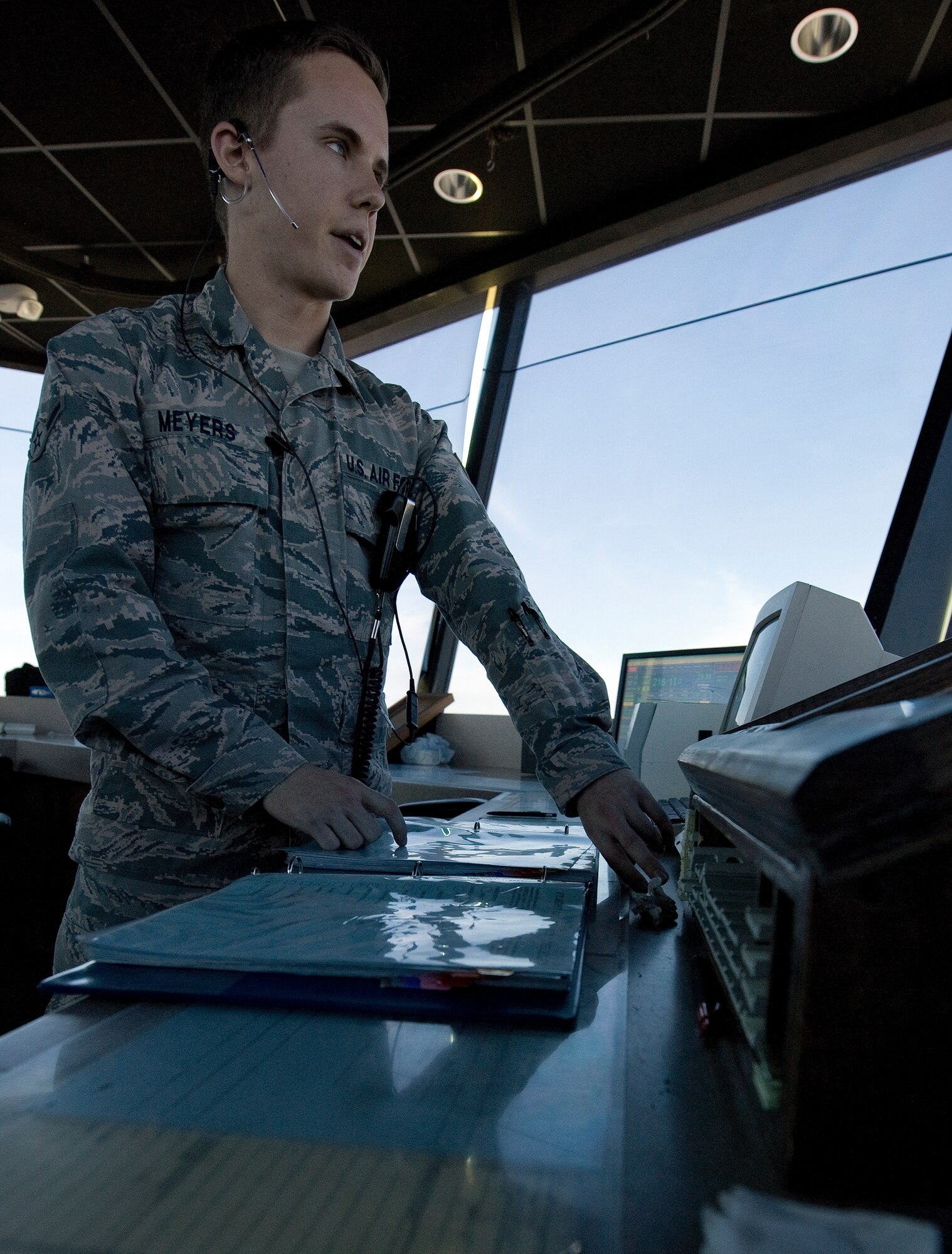 Airman Kyle Meyers, 1st Special Operations Support Squadron air traffic control apprentice, monitors air traffic on the flightline from the base tower on Hurlburt Field, Fla., July 17, 2014. Air traffic control trainees spend three months to a year learning tower operations. (U.S. Air Force photo/Senior Airman Kentavist P. Brackin)