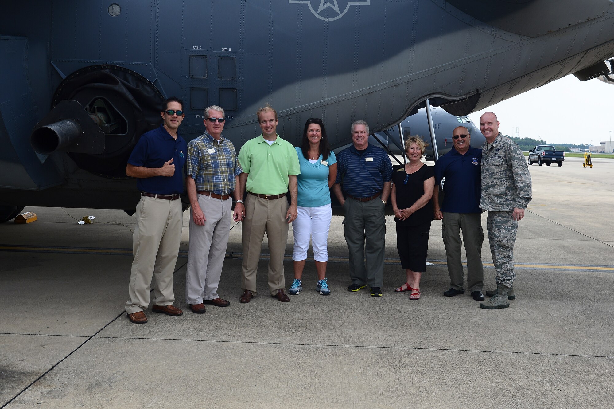 Col. Cameron, 1st Special Operations Group commander, poses for a group photo with Hurlburt Field honorary commanders next to the AC-130U Spooky Gunship at Hurlburt Field, Fla., July 18, 2014. The honorary commander program is established with local civic leaders to increase public awareness and understanding of the armed forces and the mission, policies, and programs of the Air Force, and to build relationships with members of the local community and encourage them to share the Air Force story. (U.S. Air Force photo/Airman 1st Class Jeff Parkinson)
