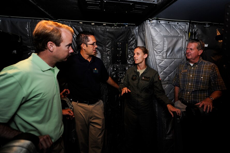 Capt. Sarah Gagnon, 4th Special Operations Squadron navigator, briefs Hurlburt Field honorary commanders on the AC-130U Spooky gunship July 18, 2014. The AC-130U Spooky directly supports unified and theater special operations commands by conducting close air support, armed reconnaissance, and interdiction missions worldwide in support of Secretary of Defense taskings. (U.S. Air Force photo/Airman 1st Class Jeff Parkinson)