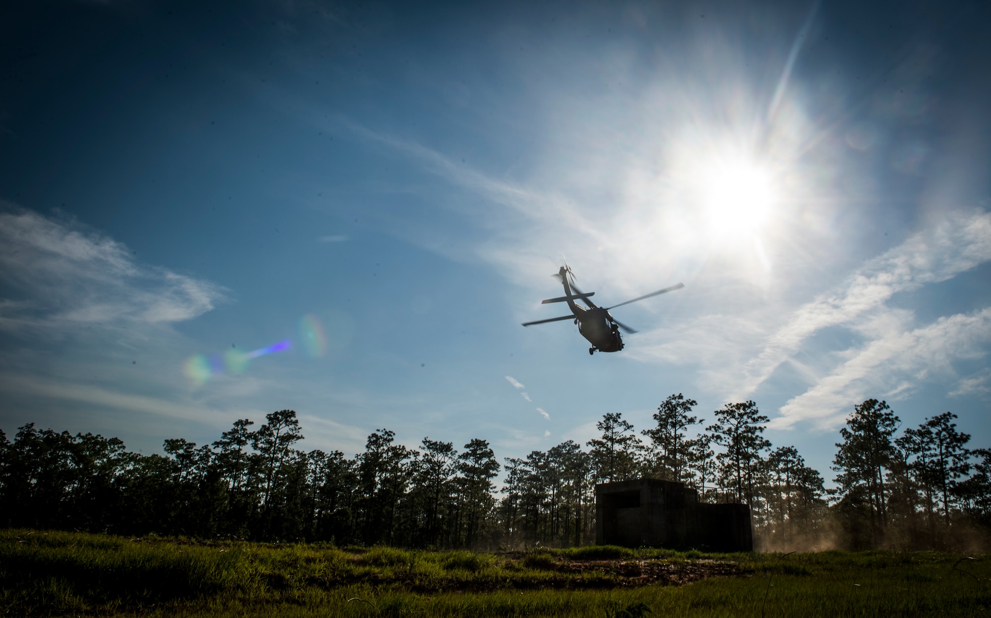 A UH-60 Black Hawk departs during an infil and exfil training exercise on Eglin Range, Fla., July 17, 2014. The 1st Special Operations Support Squadron HAVE-ACE schedules and plans joint training to ensure U.S. Special Operations Command members are ready to deploy any time, any place.  (U.S. Air Force photo/Senior Airman Christopher Callaway)