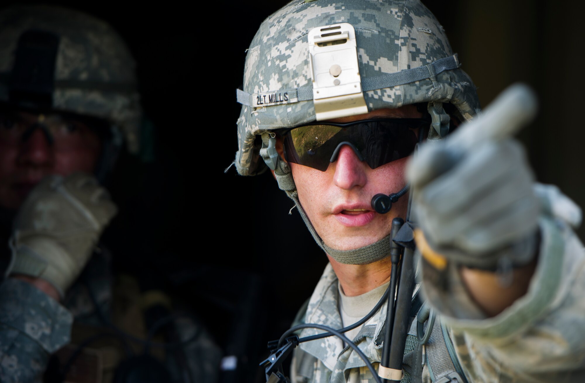 A Soldier from the 82nd Airborne Division points out a target during an infil and exfil training exercise on Eglin Range, Fla., July 17, 2014. The 1st Special Operations Support Squadron HAVE-ACE hosted a joint training exercise to continue building trusted relationships with our joint combat teammates. (U.S. Air Force photo/Senior Airman Christopher Callaway)