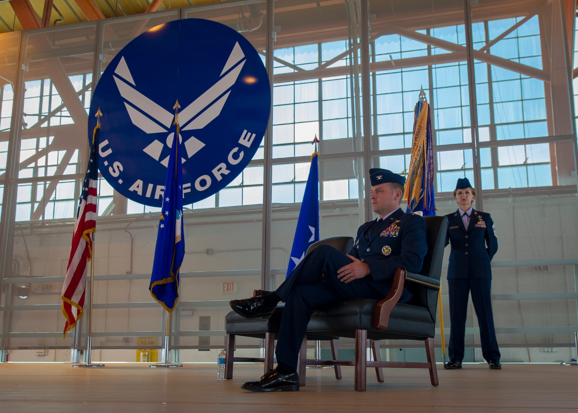 Colonel Robert Kiebler, upcoming 49th Wing commander, listens ast Lt. Gen. Tod D. Wolters, 12 Air Force (Air Forces Southern) commander, delivers his speech during an assumption of command ceremony at Holloman Air Force Base, N.M., July 18. An assumption of command is a military tradition that represents a formal transfer of authority and responsibility for a unit from one commanding officer to another. (U.S. Air Force photo by Airman 1st Class Aaron Montoya / Released)