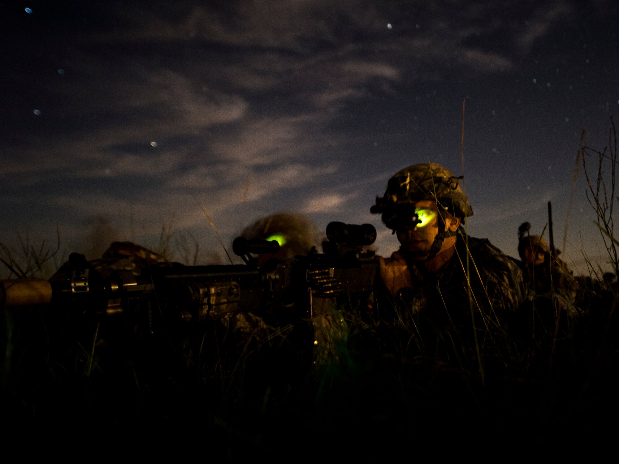 Soldiers from the 82nd Airborne Squadron post security during a training exercise on Camp Rudder, Fla., July 16, 2014. The 1st Special Operations Support Squadron HAVE-ACE hosted a joint operation exercise that allows military members to train how they fight. (U.S. Air Force photo/Senior Airman Christopher Callaway) 