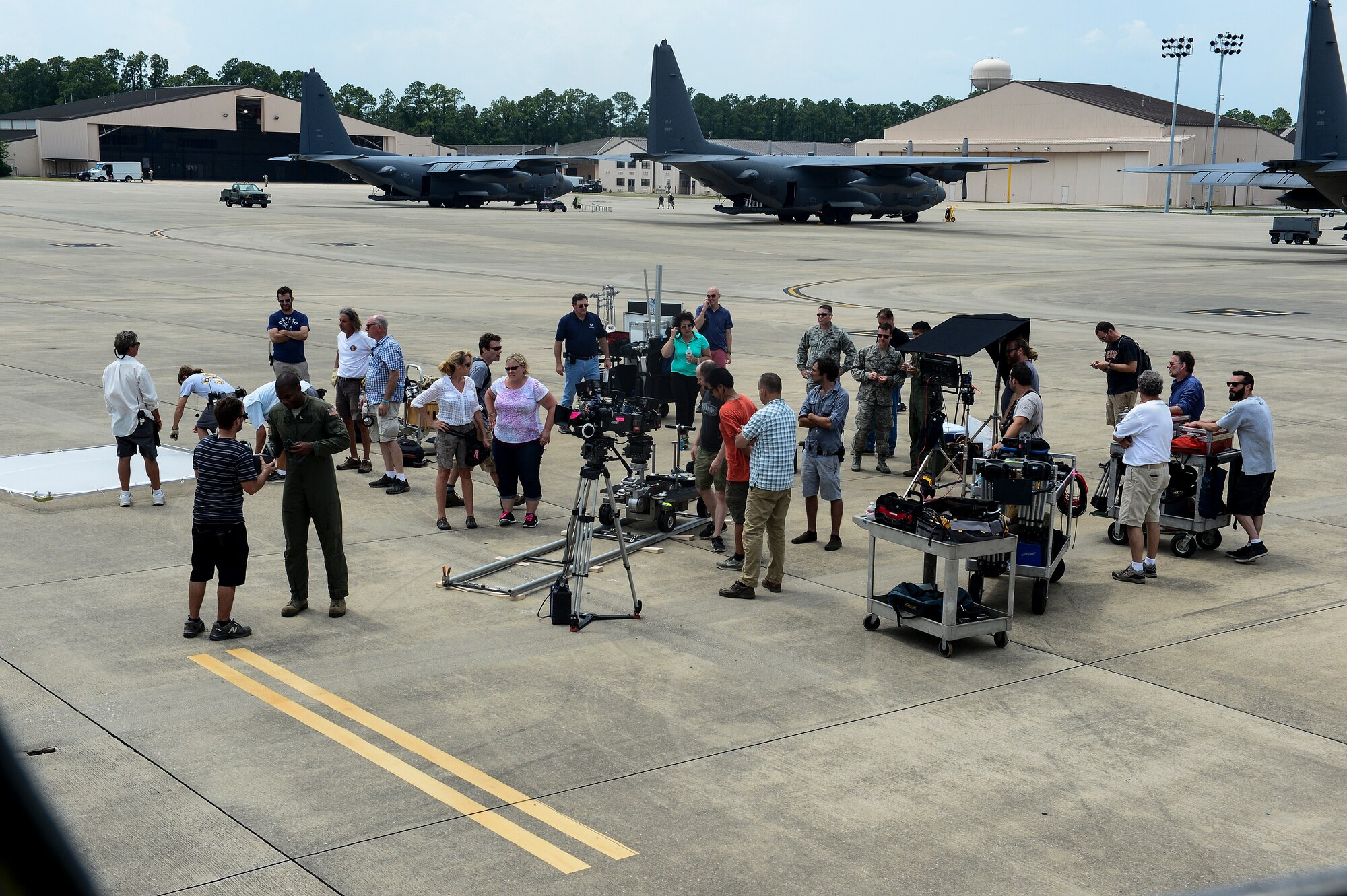 GSD&M Advertising crew set up their equipment prior to filming portions of an Air Force Recruiting commercial at Hurlburt Field, Fla., July 10, 2014. GSD&M Advertising is a company based out of Austin, TX and is contracted by the Air Force Recruiting Service to produce recruiting products. (U.S. Air Force photo/Airman 1st Class Jeff Parkinson)