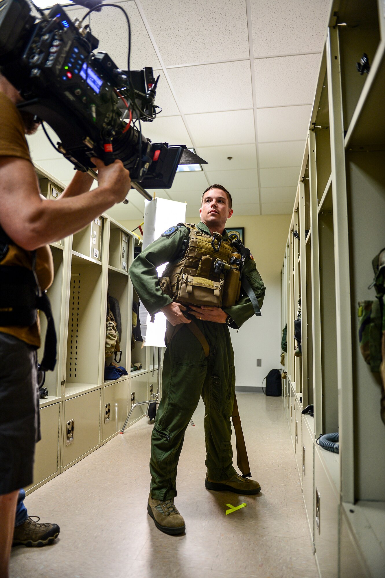 Capt. Chris Nehls, 8th Special Operations Squadron CV-22 pilot, dons his gear during the filming of an Air Force Recruiting commercial at Hurlburt Field, Fla., July 9, 2014. GSD&M Advertising is a company based out of Austin, TX contracted by the Air Force Recruiting Service. (U.S. Air Force photo/Airman 1st Class Jeff Parkinson)