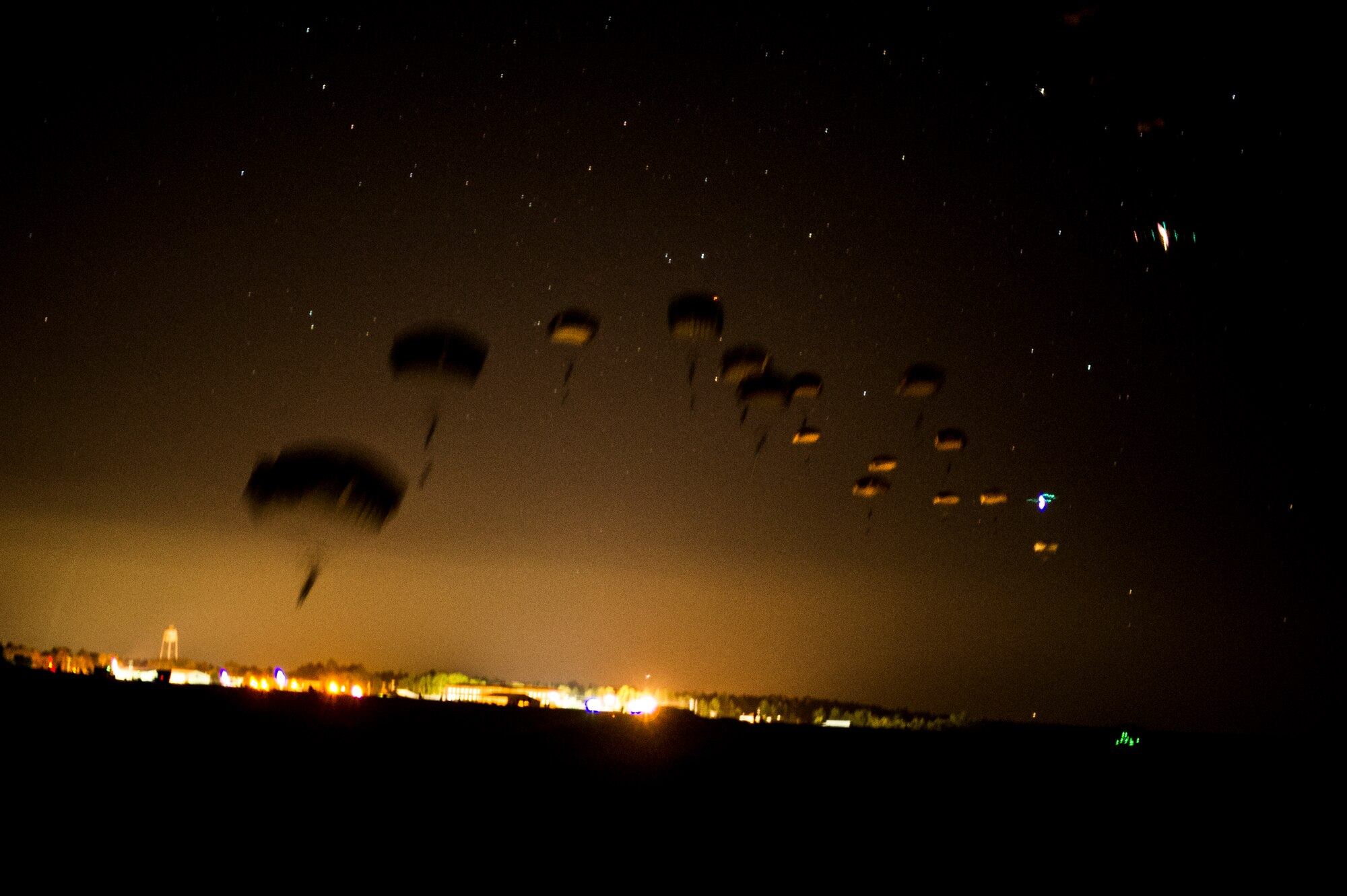 More than 400 Soldiers from the 82nd Airborne Division parachute into Camp Rudder, Fla., July 16, 2014. The 1st Special Operations Support Squadron HAVE-ACE coordinated a two-day joint training exercise to maintain a high state of readiness with fellow military members. (U.S. Air Force photo/Senior Airman Christopher Callaway)