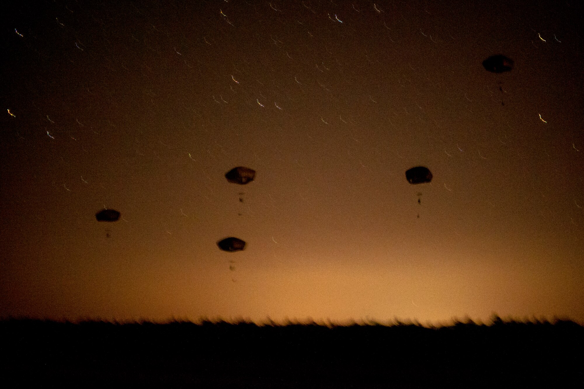 Soldiers from the 82nd Airborne Division parachute into Camp Rudder, Fla., July 16, 2014. The 1st Special Operations Support Squadron HAVE-ACE helped host a two-day joint training exercise to maintain a high state of readiness. (U.S. Air Force photo/Senior Airman Christopher Callaway) 