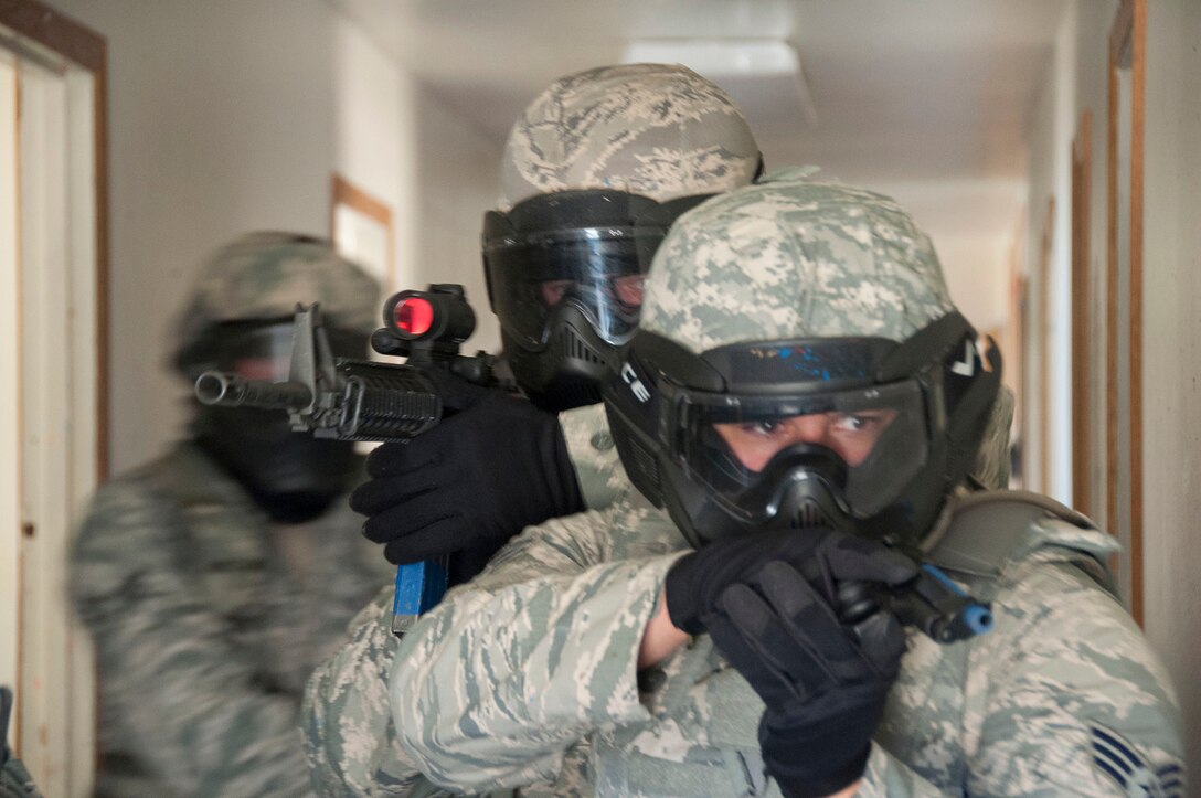 TRAVIS AIR FORCE BASE, Calif. -- Members of the 349th Security Forces Squadron participate in an active shooter exercise at Travis Air Force Base, Calif., July 13, 2014. (U.S. Air Force photo / Staff Sgt. Amelia Leonard)
