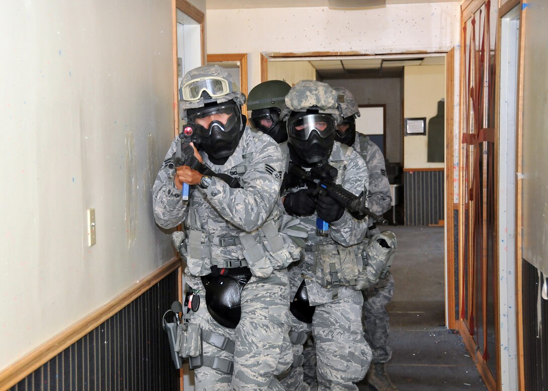 TRAVIS AIR FORCE BASE, Calif. -- Members of the 349th Security Forces Squadron participate in an active shooter exercise at Travis Air Force Base, Calif., July 13, 2014. (U.S. Air Force photo / Staff Sgt. Amelia Leonard)
