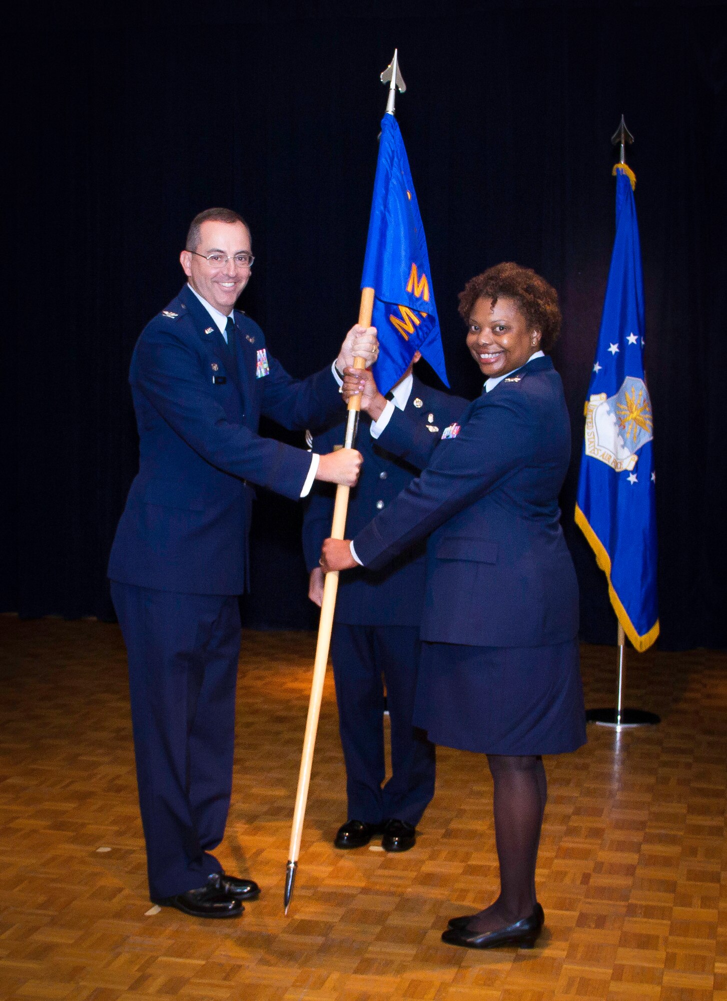 Col. Melanie Prince, 30th Medical Group commander assumes command of the 30th MDG from Col. Barbara Jones during a ceremony, July 15,2014, Vandenberg Air Force Base, Calif. Col. Keith Balts, 30th Space Wing commander presided over the ceremony. (Courtesy photo)