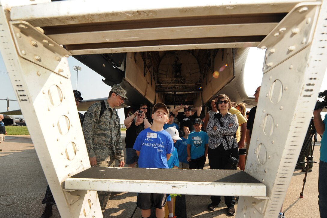 Eleven-year-old Aaron McClellan, from Lincoln, Neb., stands at the stairs leading to a B-1 Lancer cockpit at the practice airshow July 18, at Offutt Air Force Base, Neb.  The Make-A-Wish foundation along with Wounded Warriors and other special needs organizations team up with Team Offutt to give and exclusive airshow experience one day prior to the scheduled weekend event.  (U.S. Air Force photo by Josh Plueger/Released).