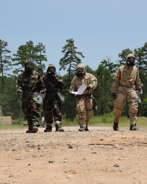 Airmen conduct a Post Attack Reconnaissance sweep during an Ability to Survive and Operate Rodeo on Barksdale Air Force Base, La., July 10, 2014. During the sweep, Airmen were looking for damage to government assets, casualties and unexploded ordnance. (U.S. Air Force photo/Staff Sgt. Sean Martin)