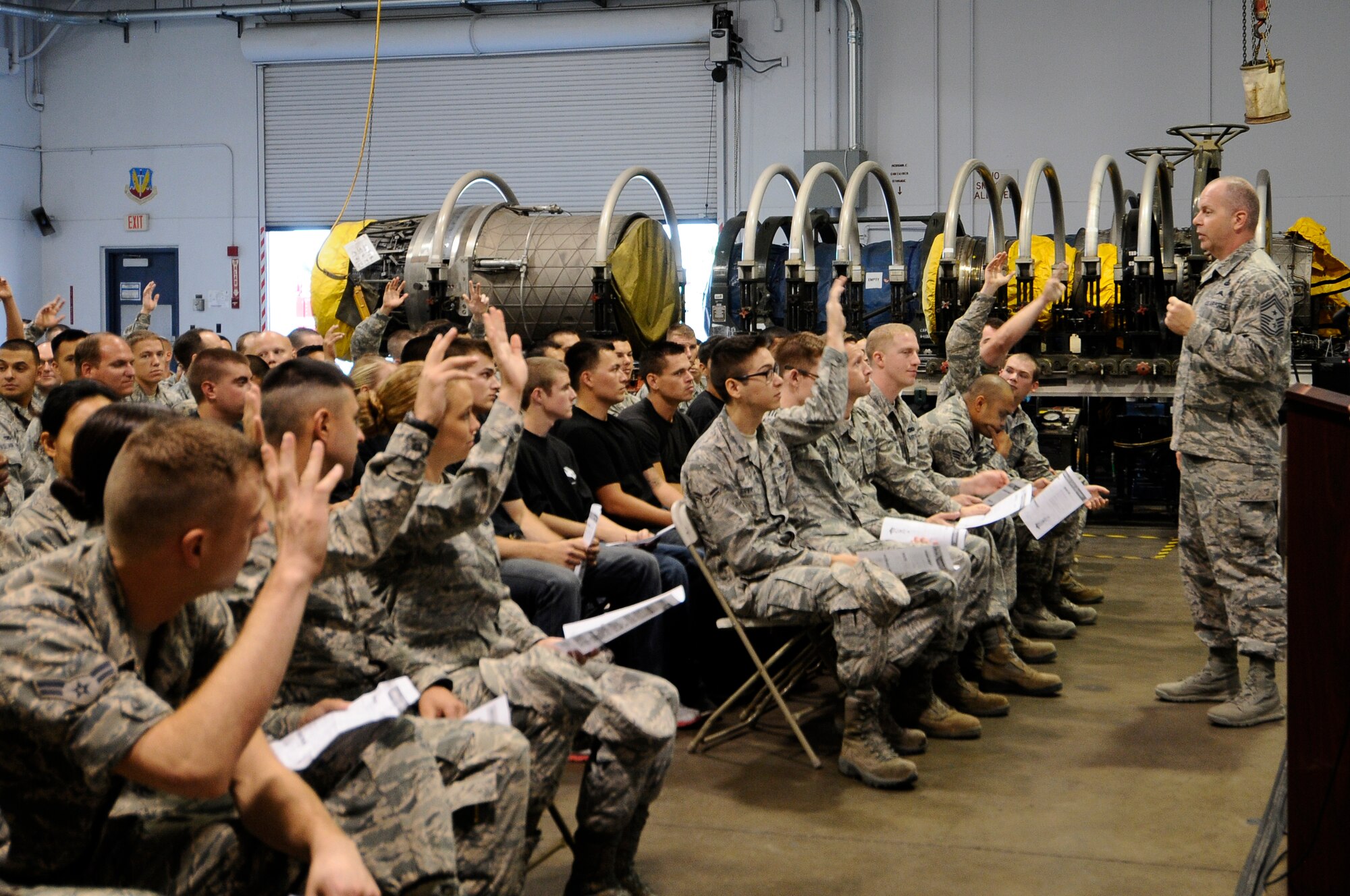 U.S. Air National Guard Command Chief Master Sgt. James W. Hotaling speaks with 144th Fighter Wing’s junior enlisted Airmen during an all call held at the Fresno Air National Guard Base, Calif., July 13, 2014. Airmen were given the opportunity to interact with Chief Hotaling and ask him any questions they had about the Air Force and the Air National Guard.  (U.S. Air National Guard photo by Airman 1st Class Klynne Pearl Serrano/Released)