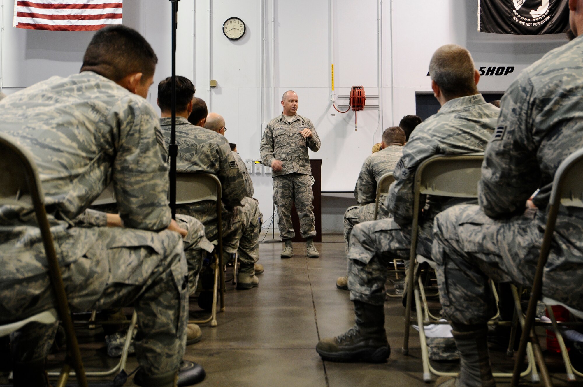 U.S. Air National Guard Command Chief Master Sgt. James W. Hotaling speaks with 144th Fighter Wing’s junior enlisted Airmen during an all call held at the Fresno Air National Guard Base July 13, 2014. Airmen were given the opportunity to interact with Chief Hotaling and ask him any questions they had about the Air Force and the Air National Guard.  (U.S. Air National Guard photo by Airman 1st Class Klynne Pearl Serrano/Released)