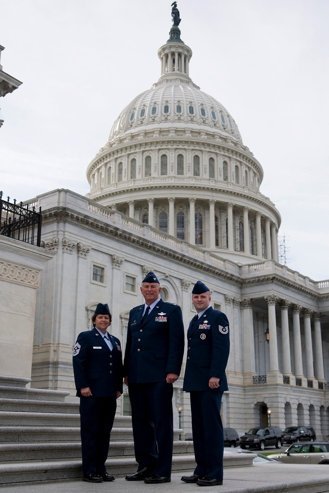 From left to right, Chief Master Sgt. Karen Perkins, 434th Air Refueling Wing command chief; Col. Doug Schwartz, 434th ARW commander; and Tech. Sgt. Mark R. W. Orders-Woempner, 434th ARW public affairs specialist, pose for a photo in front of the Capitol in Washington D.C. during a Capitol Hill visit June 16, 2014. During the trip, the three visited six members of Indiana?s congressional delegation on Capitol Hill to talk about Grissom?s role in the nation?s defense, Indiana economy and future. (U.S. Air Force photo/Tech. Sgt. Mark R. W. Orders-Woempner)