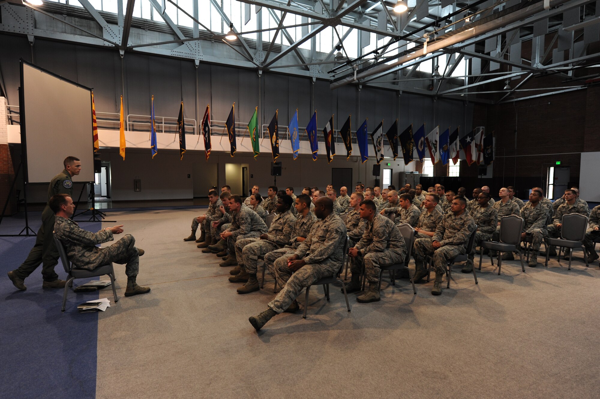 Capt. John Mayer, Force Improvement Program team leader for 20th Air Force, fields a question posed by a security forces member during a Q&A session at F.E. Warren Air Force Base, Wyoming, July 9. Town-hall style discussions like these served to answer questions and provide clarification on the FIP, and were well-received by Airmen across the command.
