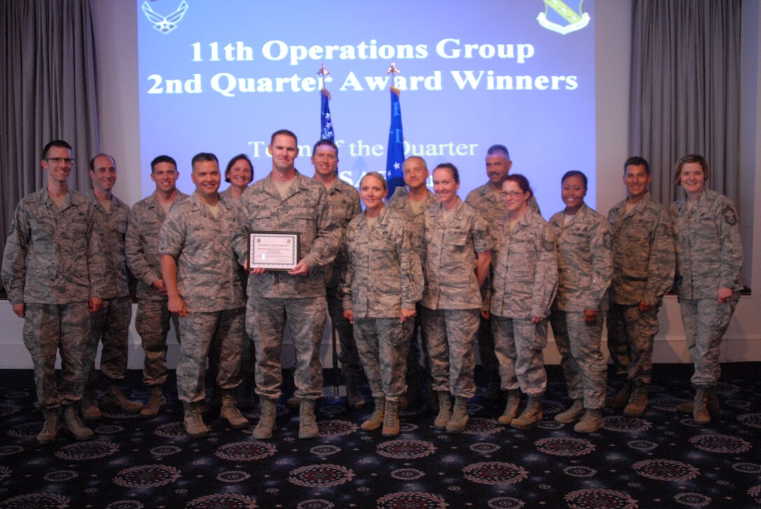 The Band's National Tours team is presented with a certificate for winning
team of second quarter for the 11th Operations Group. (U.S. Air Force
photo/released)