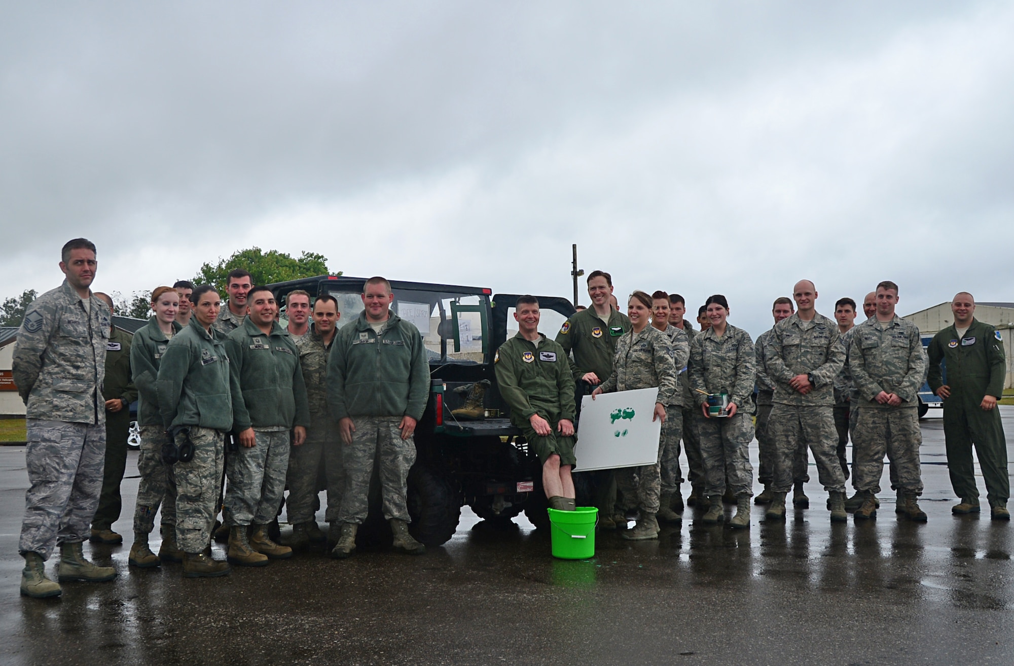 Col. Kyle Robinson, 48th Fighter Wing commander, poses with members of the 56th Rescue Squadron after his final flight on the HH-60G Pave Hawk with the 56th Rescue Squadron at Royal Air Force Lakenheath, England, July 10, 2014. Robinson is a command pilot with flying experience in the B-1B Lancer bomber and the F-15E Strike Eagle. (U.S. Air Force photo by Airman 1st Class Erin O’Shea/Released)