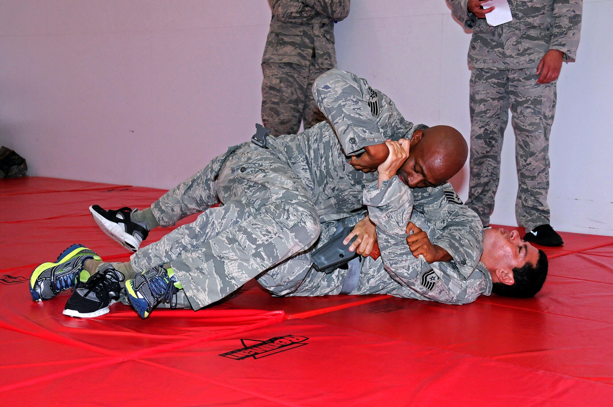 Staff Sgt. Jermayl D. Jackson grapples with Tech. Sgt. Rickie Cancel while
training at Homestead Air Reserve Base, Fla., July 15. (U.S. Air Force
photo/Senior Airman Nicholas Caceres)
