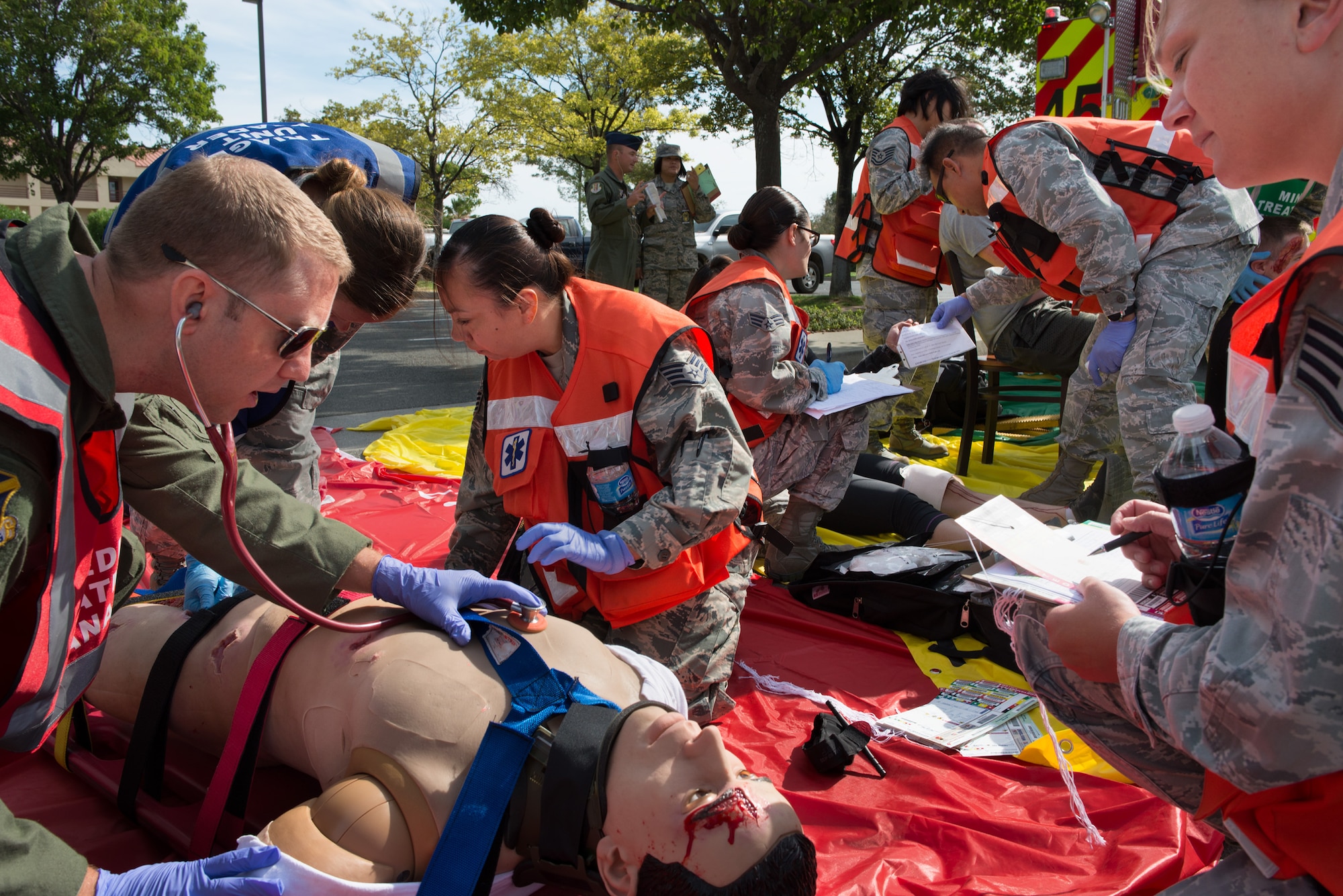 First responders from the 60th Medical Group work together to save victims of a simulated earthquake Tuesday morning, during a training exercise on Traivs Air Force Base. (U.S. Air Force photo/Ken Wright)